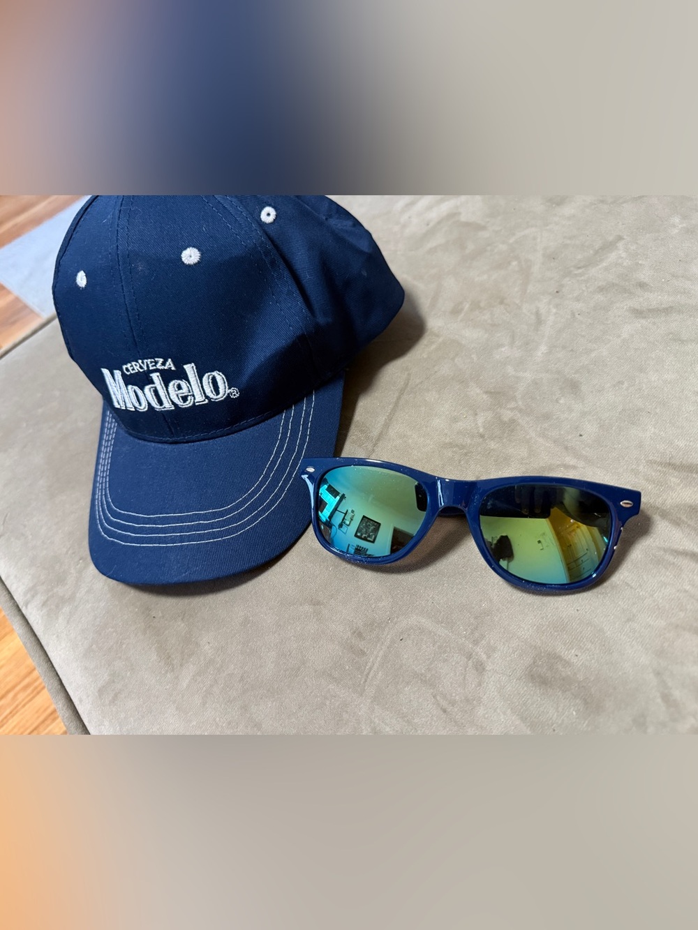 ModelCo Navy Blue Baseball Cap with White Embroidered Logo and Sunglases